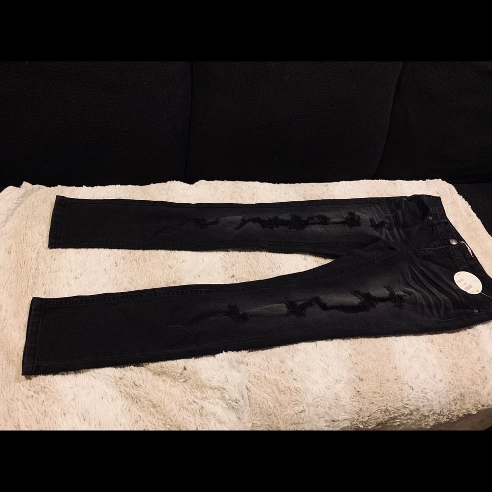 Low waisted black distressed skinny jeans